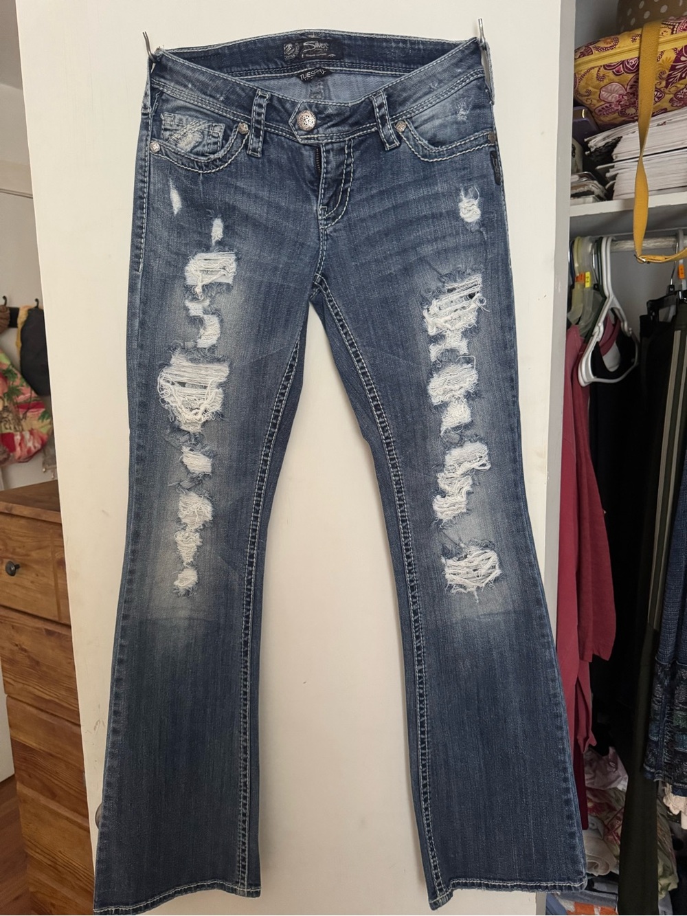 Silver Jeans Distressed Flare Jeans in Dark Blue